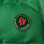 Button auf einer Jacke mit der "Aufschrift HSV - Werdohl Versetal"